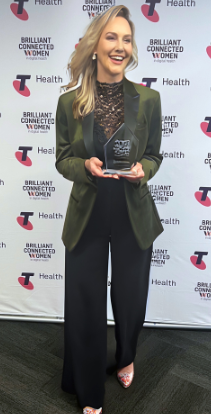 Dr Angie Montgomery holding the 2022 Telstra Health Brilliant Women in Digital Health Award